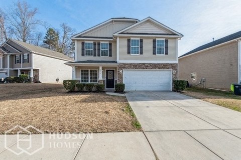 a house with a driveway and a white garage door
