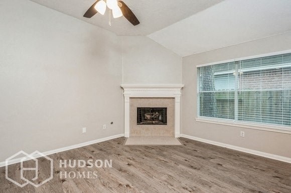 a living room with a fireplace and a window