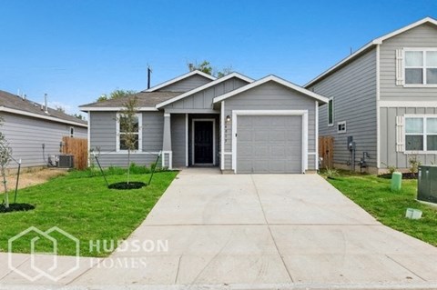 a with a driveway and a garage door
