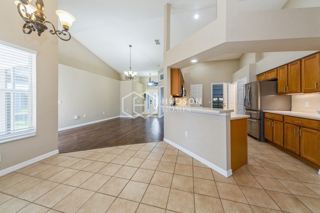 a kitchen and living room with an open floor plan