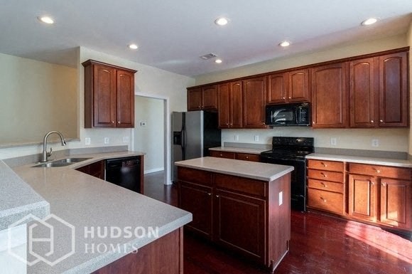 Hudson Homes Management Single Family Home For Rent Pet Friendly remodeled kitchen remodeled bathroom beautiful large lawn washer dryer connection black appliances high ceilings 2961 Nairn Court Douglasville GA	30135