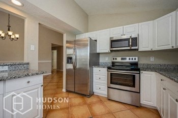 Hudson Homes Management Single Family Home For Rent Pet Friendly 11224 Bramblebrush St Tampa FL 33624 3 bedrooms 2 bathrooms carpet high ceilings stainless steel appliances ceiling fans dishwasher refrigerator microwave granite countertops attached garage - Photo Gallery 6