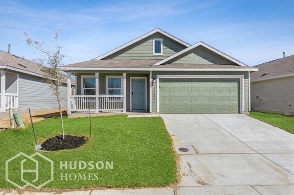 a house with a lawn and a driveway