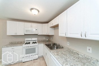 Hudson Homes Management Hudson Homes Management Single Family Home For Rent Pet Friendly 5667 Radcliffe Ave Youngstown OH 44515 3 bedrooms white appliances dishwasher microwave attached garage backyard split level - Photo Gallery 5