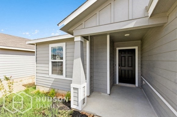 a front door of a house with a porch