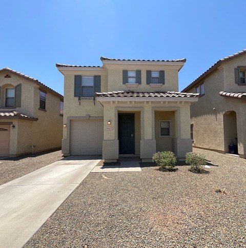 a house with a driveway in front of it