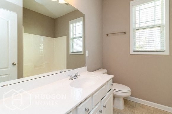 Hudson Homes Management Single Family Home For Rent Pet Friendly remodeled kitchen remodeled bathroom beautiful large lawn washer dryer connection black appliances high ceilings 2961 Nairn Court Douglasville GA	30135