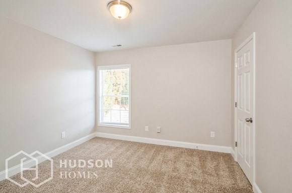 a empty room with a door and a window