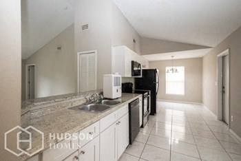 Hudson Homes Management Single Family Home For Rent Pet Friendly 404 Hope Circle Orlando Florida 32811 attached garage vaulted ceilings 4 bedroom back yard dishwasher - Photo Gallery 9