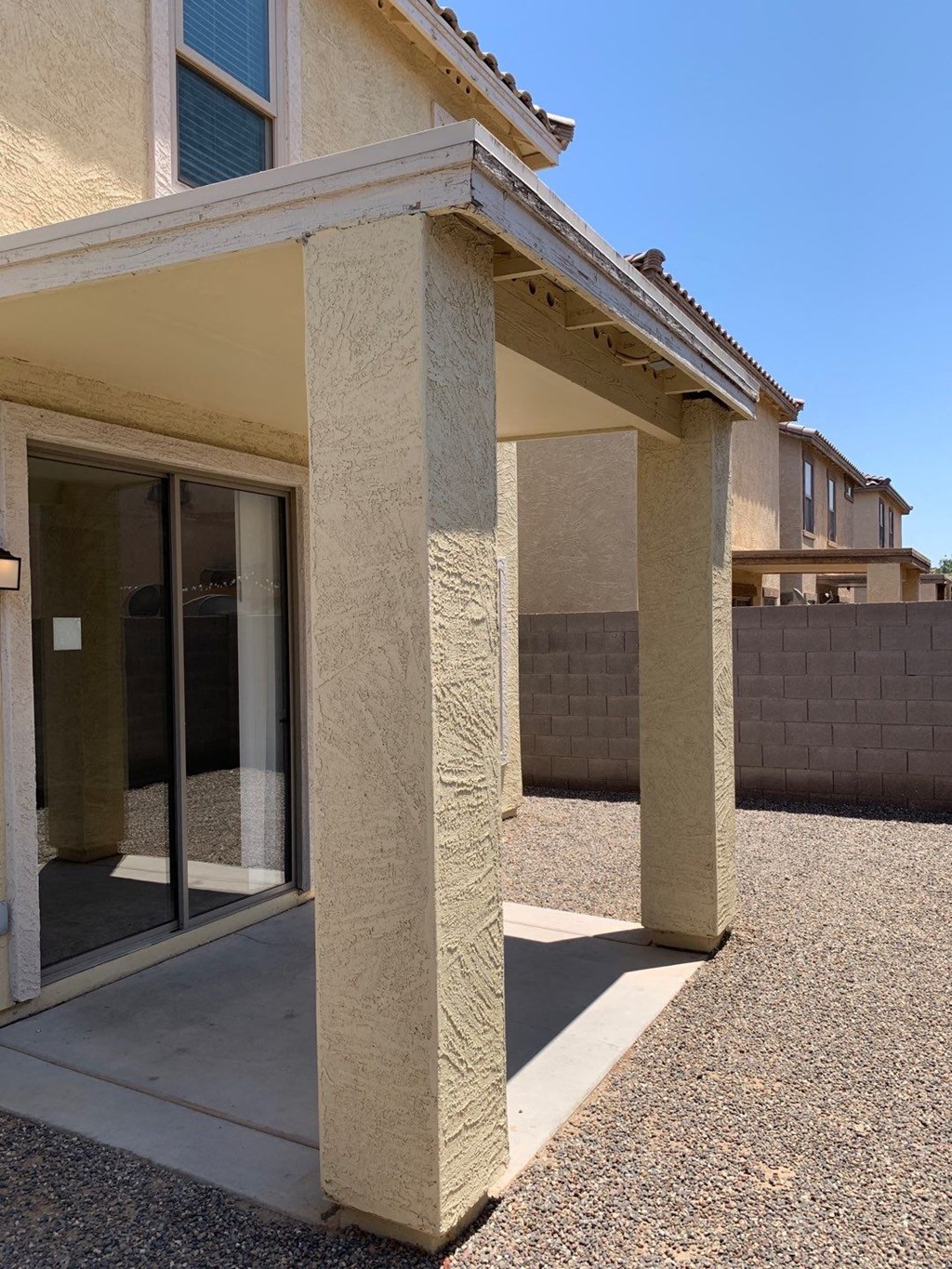 a covered porch in front of a house