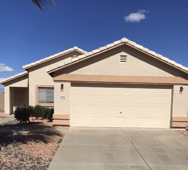 a house with a white garage door in front of it