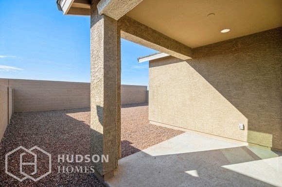 a view of the side of a building from the entrance of a house