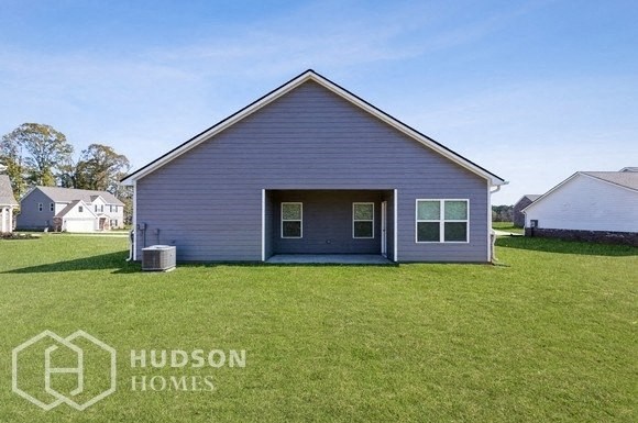 a house with a lawn in front of it
