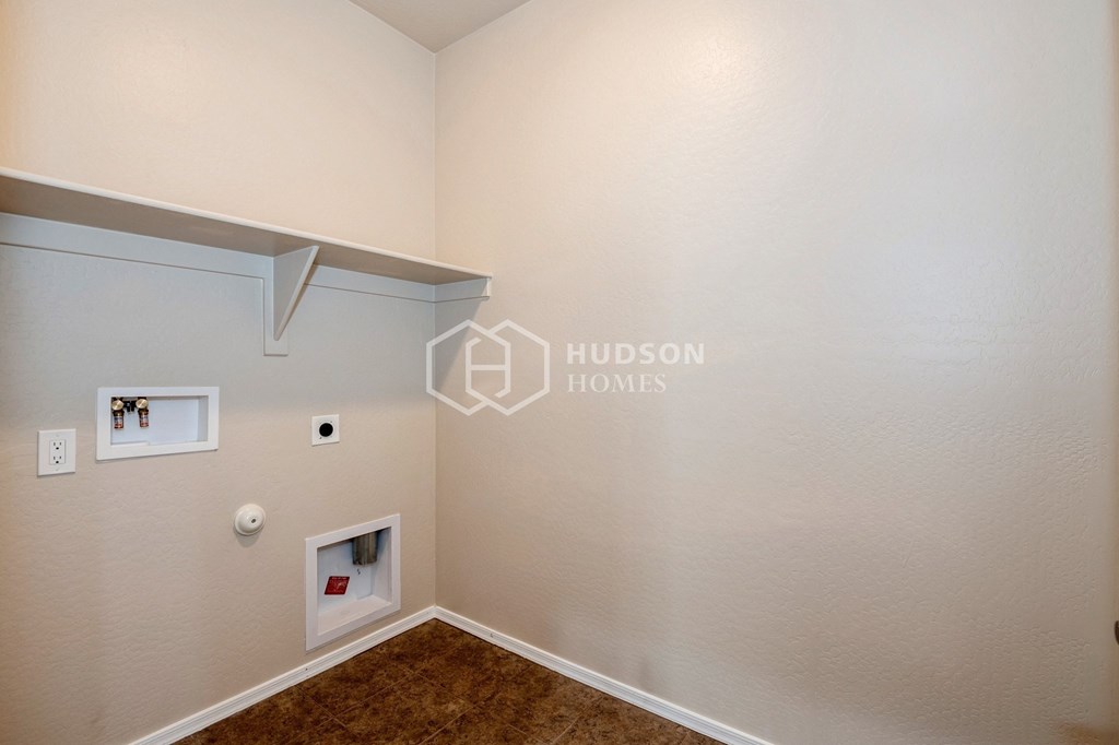 a white room with a white wall and a brown carpet