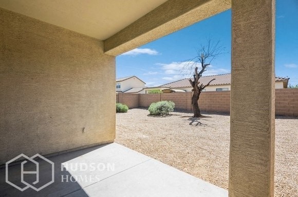 a view of the backyard from the patio of a house