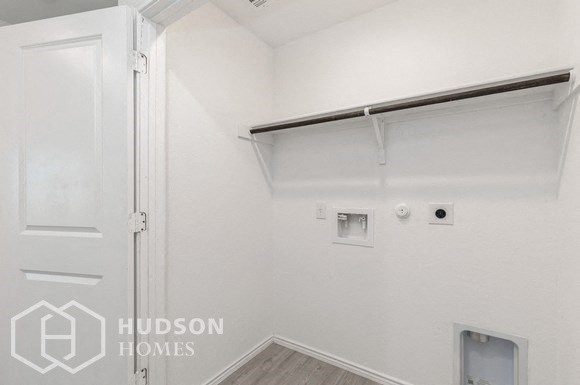 an empty white room with a white door and a white wall with a sliding closet