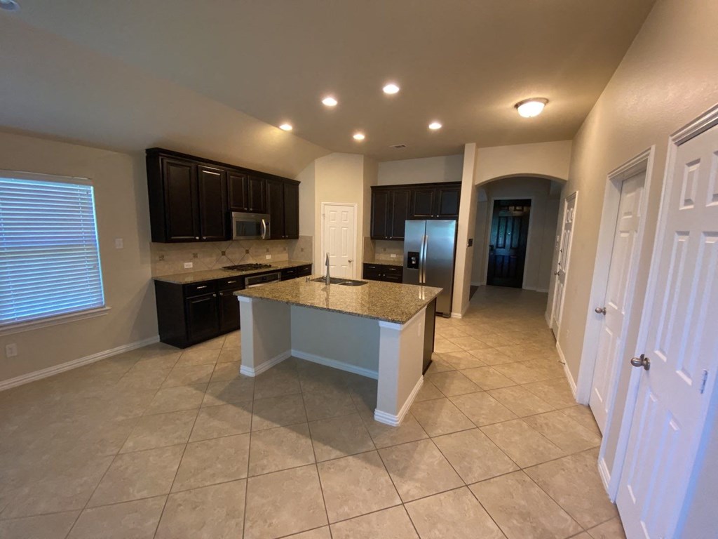 a kitchen with a counter top and a sink
