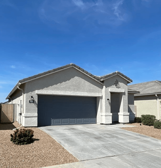a house with a driveway and a garage door