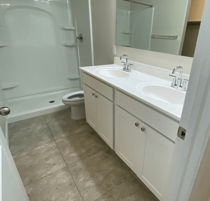 a bathroom with a sink and a toilet and a bath tub