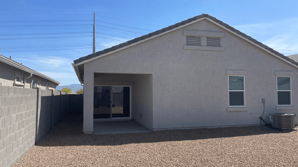 a view of the outside of a house with the door open