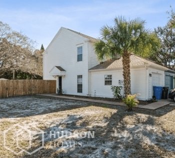 Hudson Homes Management Single Family Home For Rent Pet Friendly 6115 Oak Cluster Circle Tampa FL 33634 2 bedrooms 2.5 bathrooms ceiling fans refrigerator laundry room attached garage screened porch fenced yard - Photo Gallery 2
