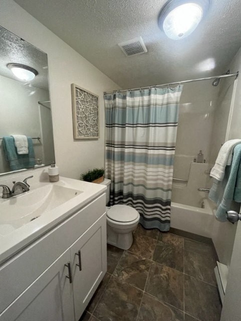 a bathroom with a toilet sink and bathtub at North Pointe Commons, Pittsburgh