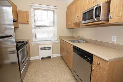 a kitchen with stainless steel appliances and a sink
