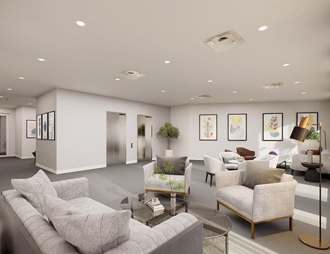 A modern living room with a grey sofa and a glass coffee table.