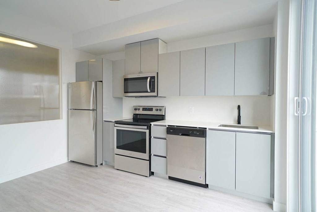 Kitchen With Modern Finishings at 703 St. Anne's Road Apartments, Winnipeg,MB