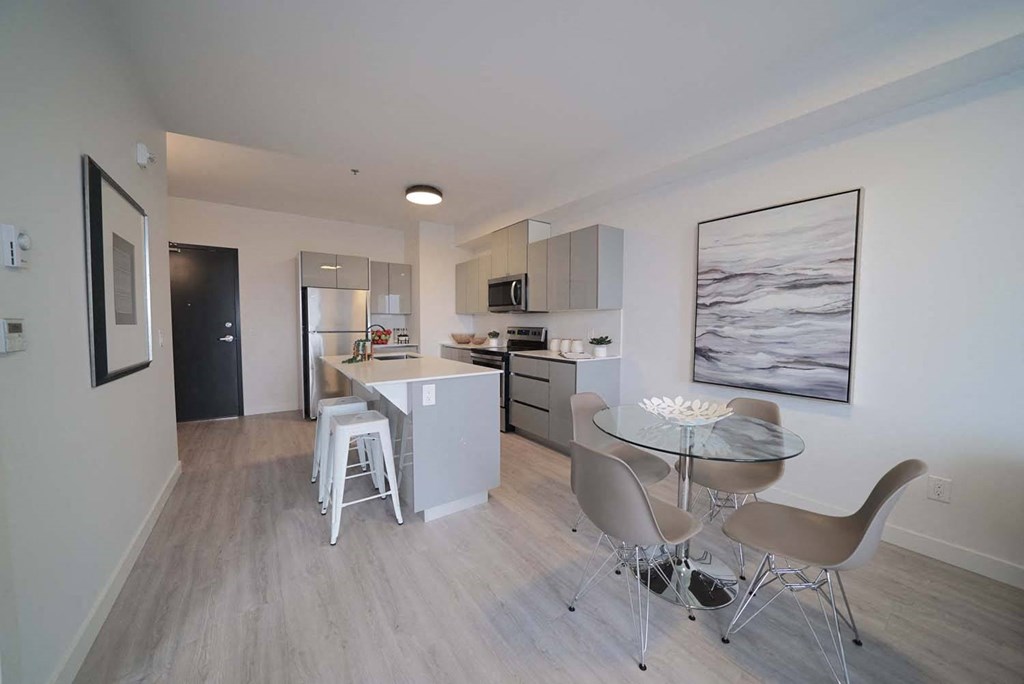Modern Kitchen With Dining Area at 703 St. Anne's Road Apartments