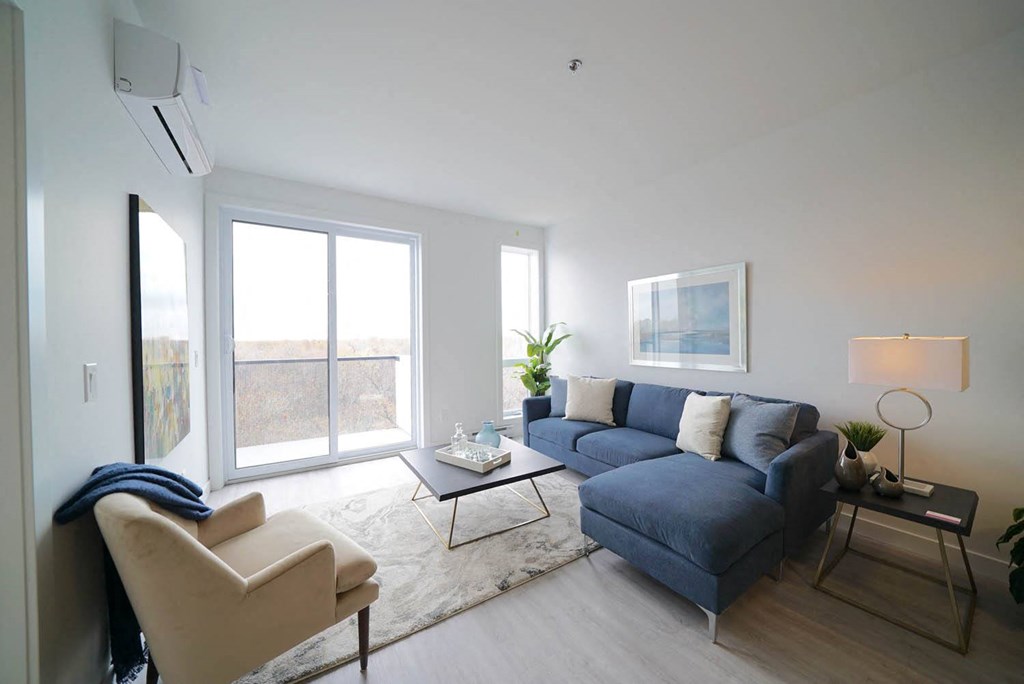 Spacious Living Room With Large Windows at 703 St. Anne's Road Apartments, Winnipeg, MB