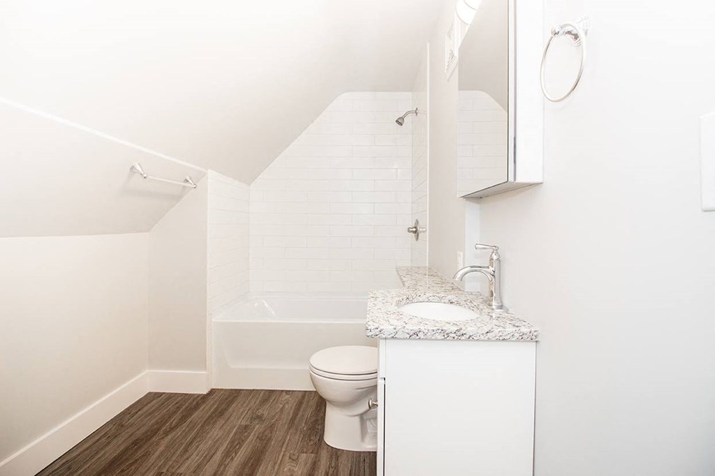 a bathroom with a toilet sink and bathtub