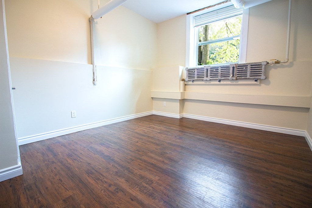 Bedroom at 105 Clarke Apartment Suites next to Forks