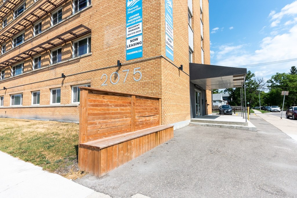 The image shows a building with the number 2075 on it.