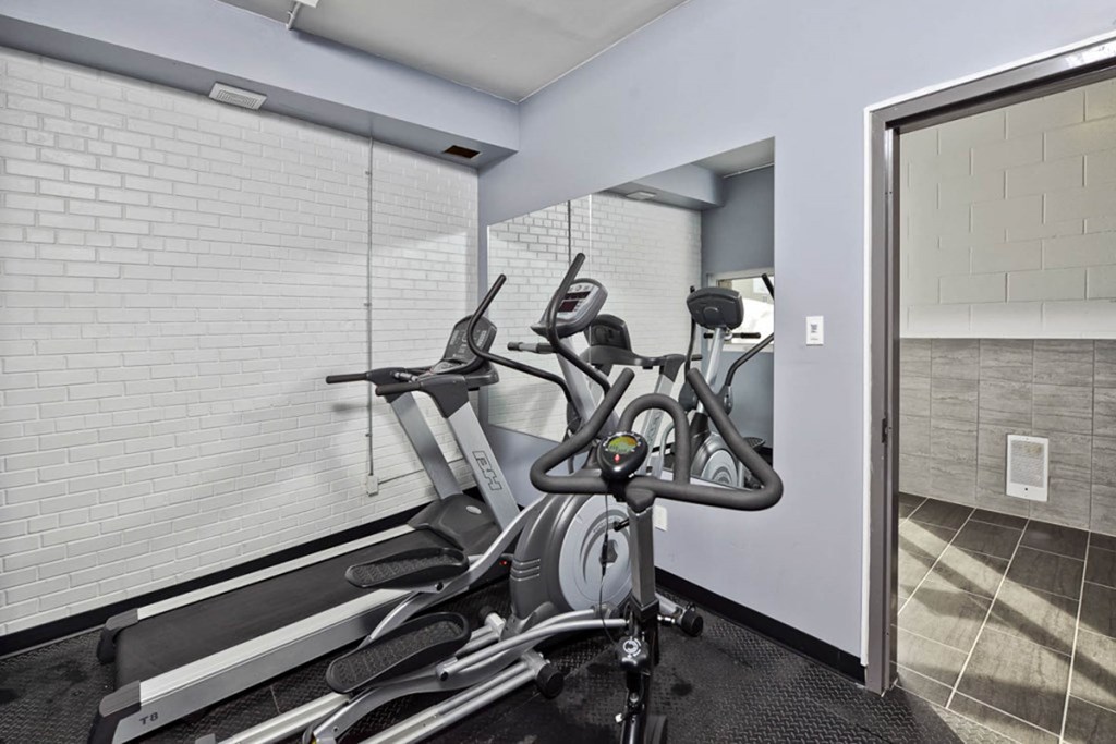 Fitness Room with Cardio Machines Onsite Fitness Room at 340 Assiniboine Apartment