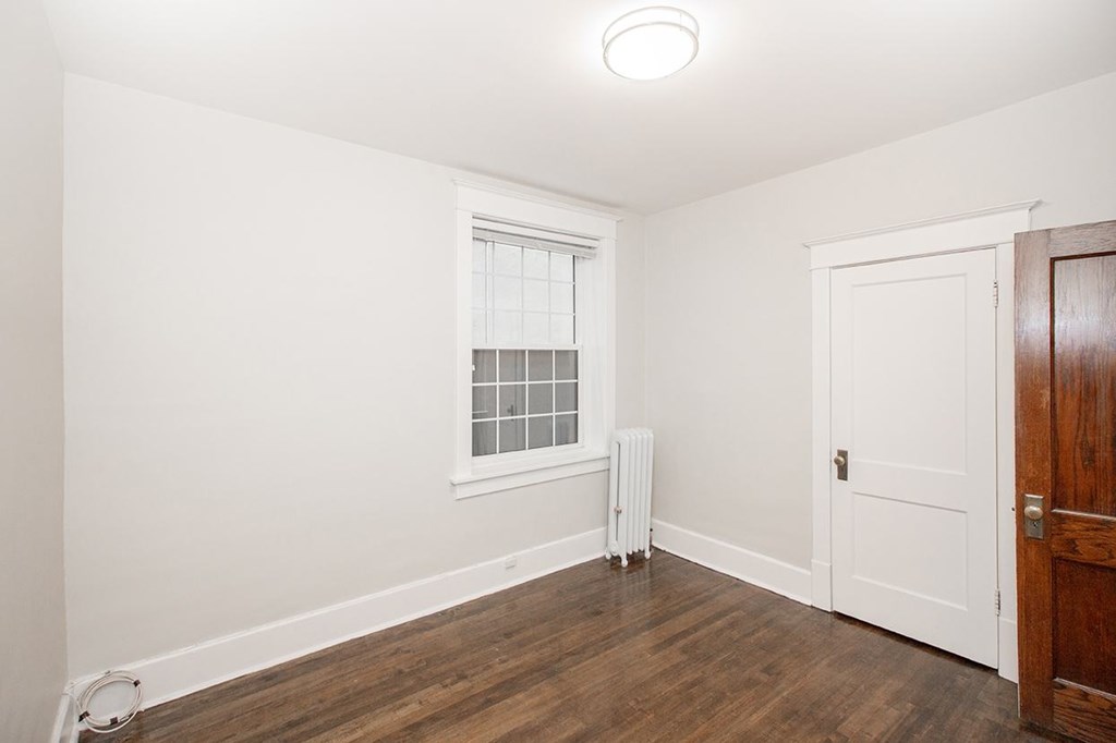 A room with a window and a door.