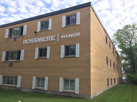 Front view of Rossmere Manor building at 359 Edison Avenue with large windows and brick exterior.