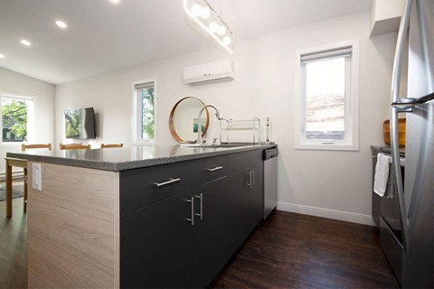 a kitchen with a counter top and a sink