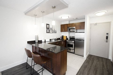 a kitchen with a counter top and a refrigerator