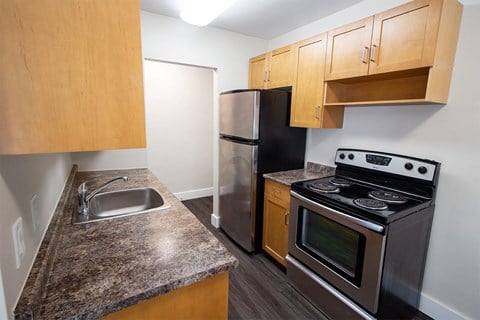 a kitchen with stainless steel appliances and granite counter tops and