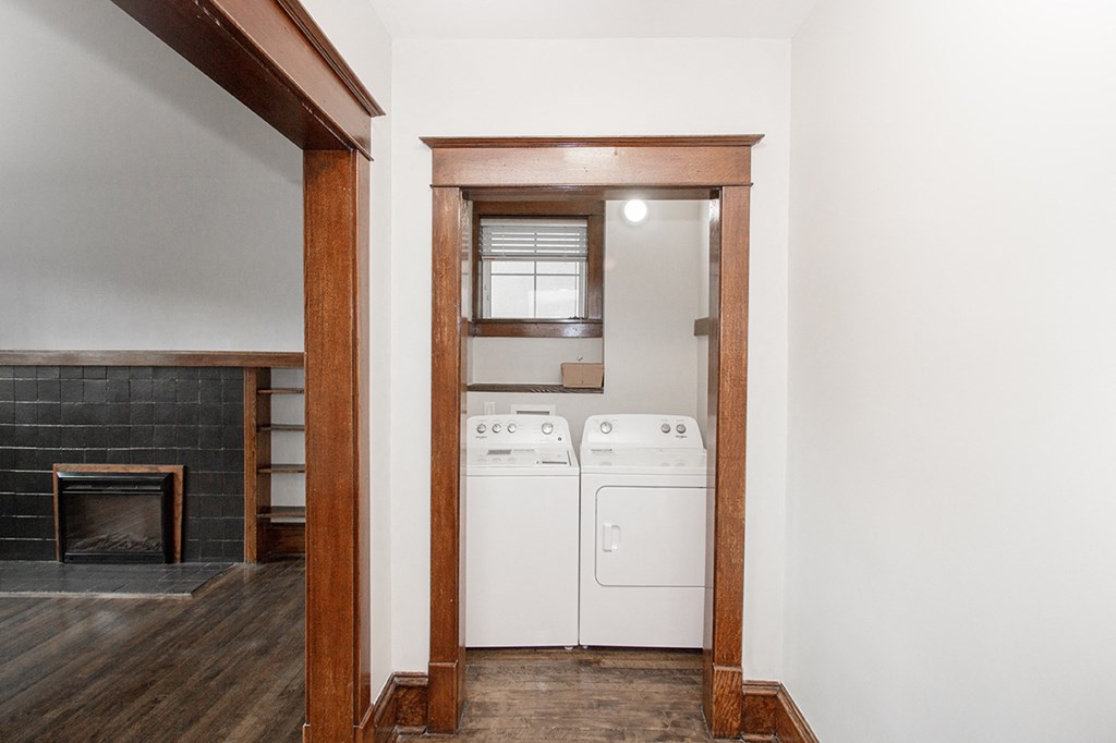 A laundry room with a washer and dryer at two-bedroom suite for rent in Winnipeg