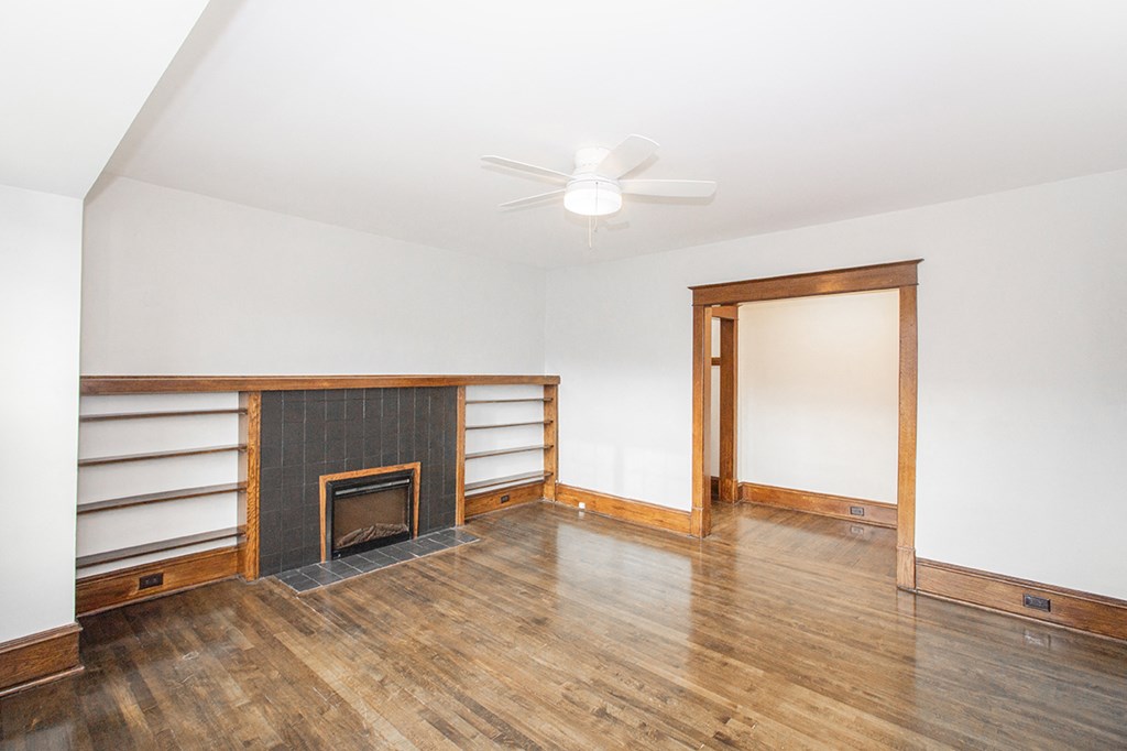 A living room with a fireplace at 883 Grosvenor Apartments for rent in Manitoba