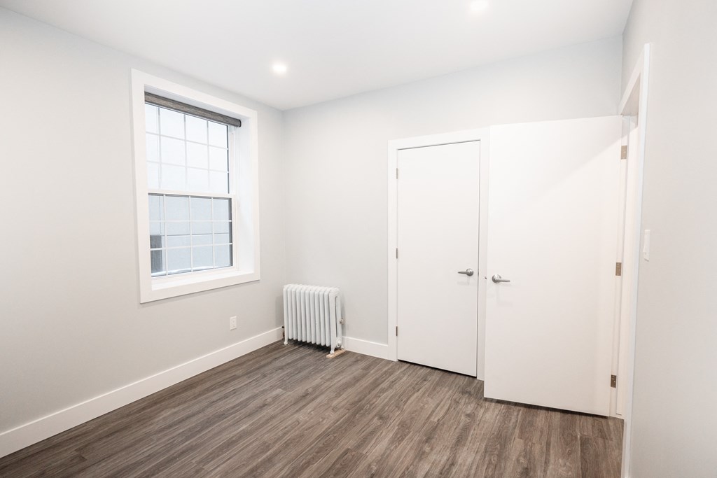 A bedroom at a two-bedroom suite for rent in Winnipeg, MB