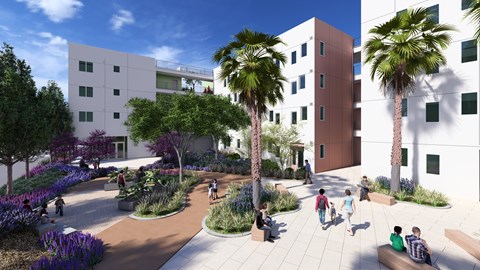 A modern courtyard with people sitting and walking around.