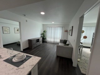 A living room with a couch and a television.