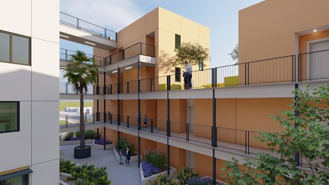 A man is standing on a balcony of a building.