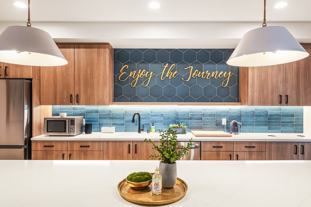an image of a kitchen with a sign that says enjoy the journey