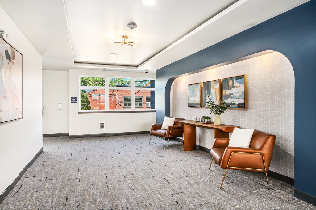 a conference room with blue walls and a table with chairs