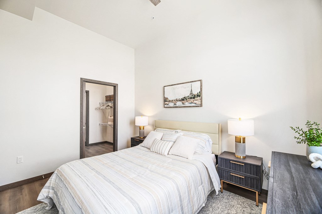 a bedroom with a bed and a mirror