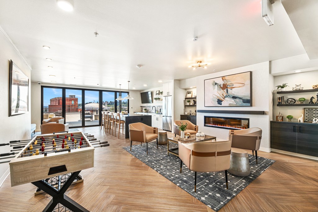 a living room with a fireplace and a table with chairs